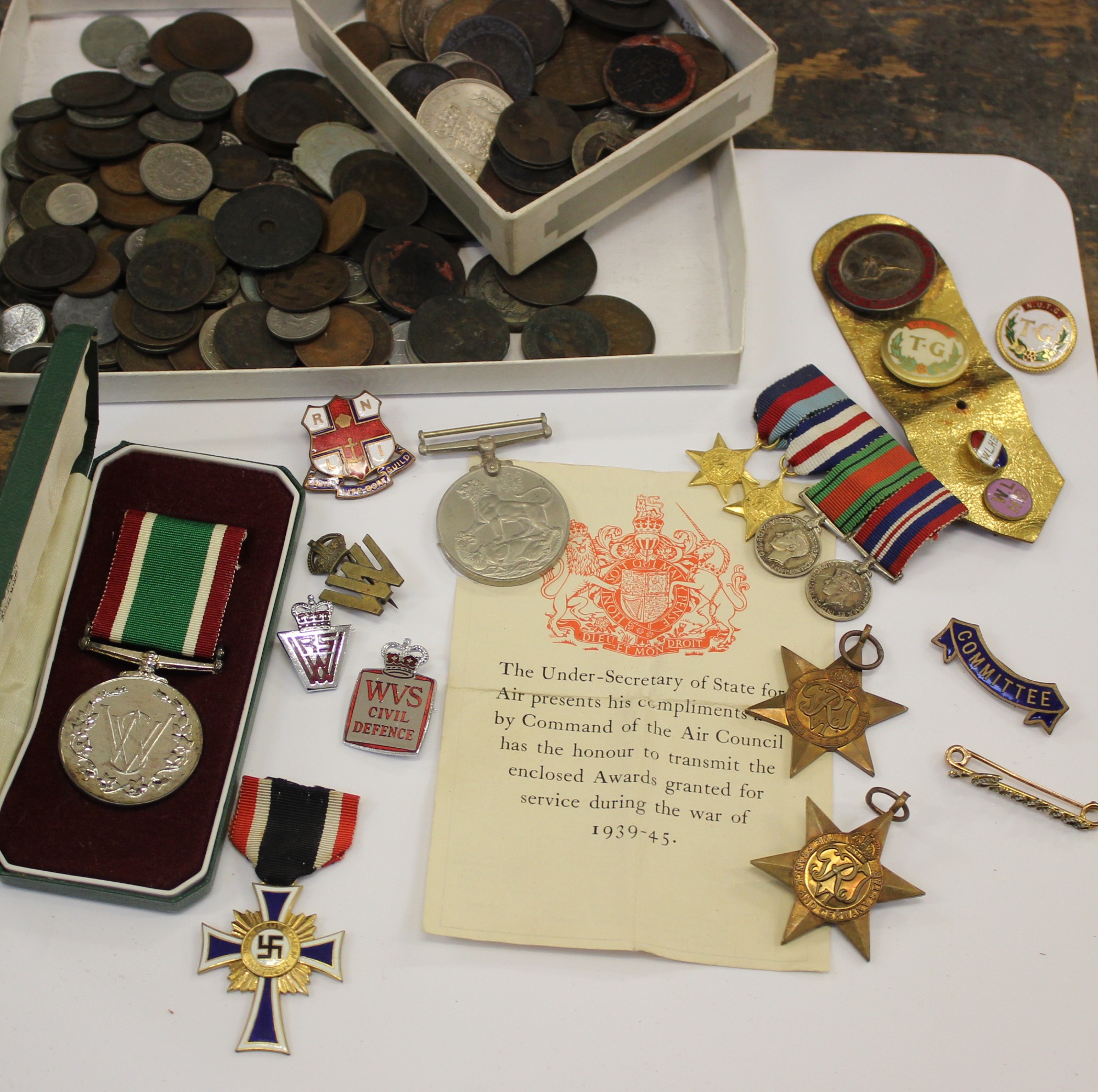 A group of 2nd World War medals, badges and a collection of coins