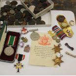 A group of 2nd World War medals, badges and a collection of coins
