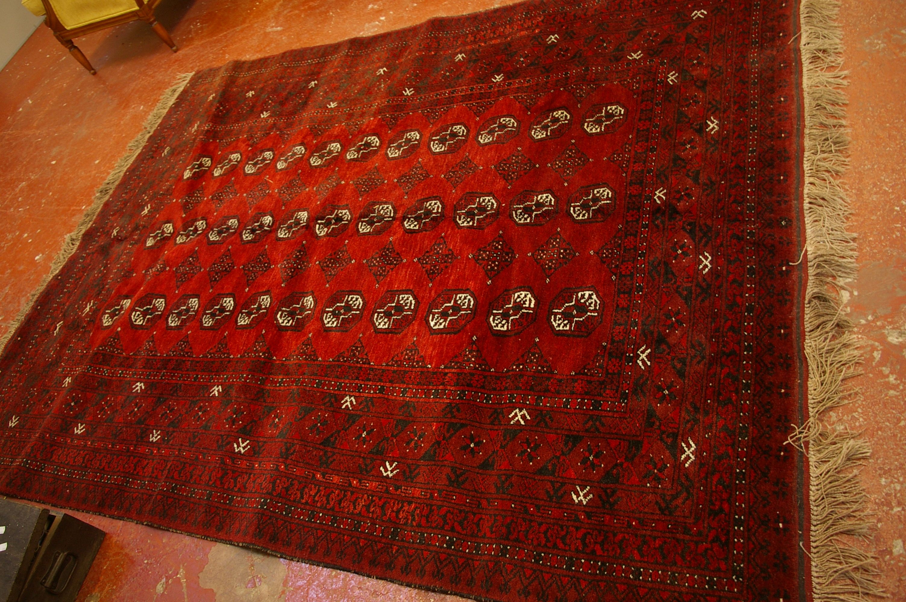 An Afghan carpet 190 x 238cm