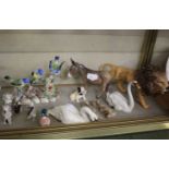 A Beswick lion, donkey and swan and further animalia and five Doulton ladies