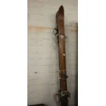 A pair of 1930's skis and selection of flyfishing rods