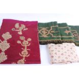 A mixed lot of textiles, to include curtains, silk damask, red silk, offcuts and a green wool