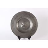 A Dutch pewter broad-rimmed charger, presented to the ‘Gresham Club’, possibly early 18th