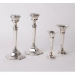 A pair of silver candlesticks Sanders & Mackenzie, Birmingham, 1964, and a pair of silver spill