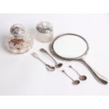 A silver mounted cut glass scent bottle, London 1898, a jar, a silver moulded round hand mirror,