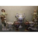 A pair of Royal Dux porcelain figures (af), a pair of continental figural groups and a pair of