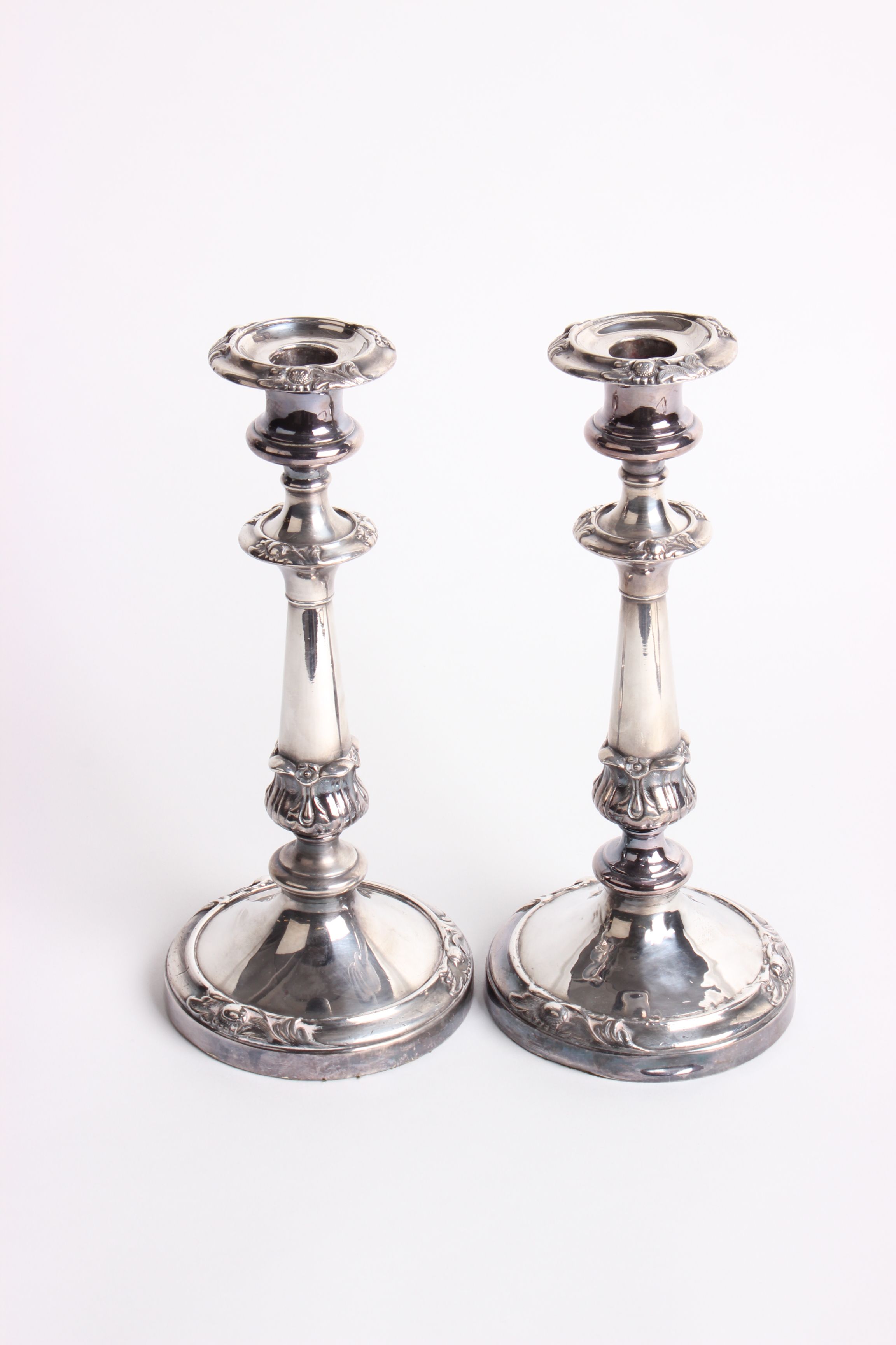 A pair of silver plated table candlesticks with sconces, height 28cm