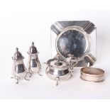 A silver salt cellar, F & Co, Birmingham, 1904, pair of shakers, napkin ring and ashtray 6ozt