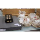 A part Royal Albert tea set with original box and a Waterford photo frame