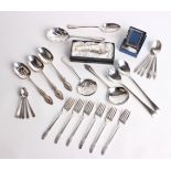 A collection of silver and various plated flatware comprising a silver sugar tong, Sheffield 1949, a