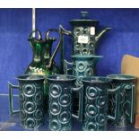 A Portmeirion turquoise glazed coffee set with four mugs (13) and a pair of green glass