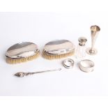 Silver: A pair of silver backed hairbrushes, a silver topped clear glass scent bottle with inner