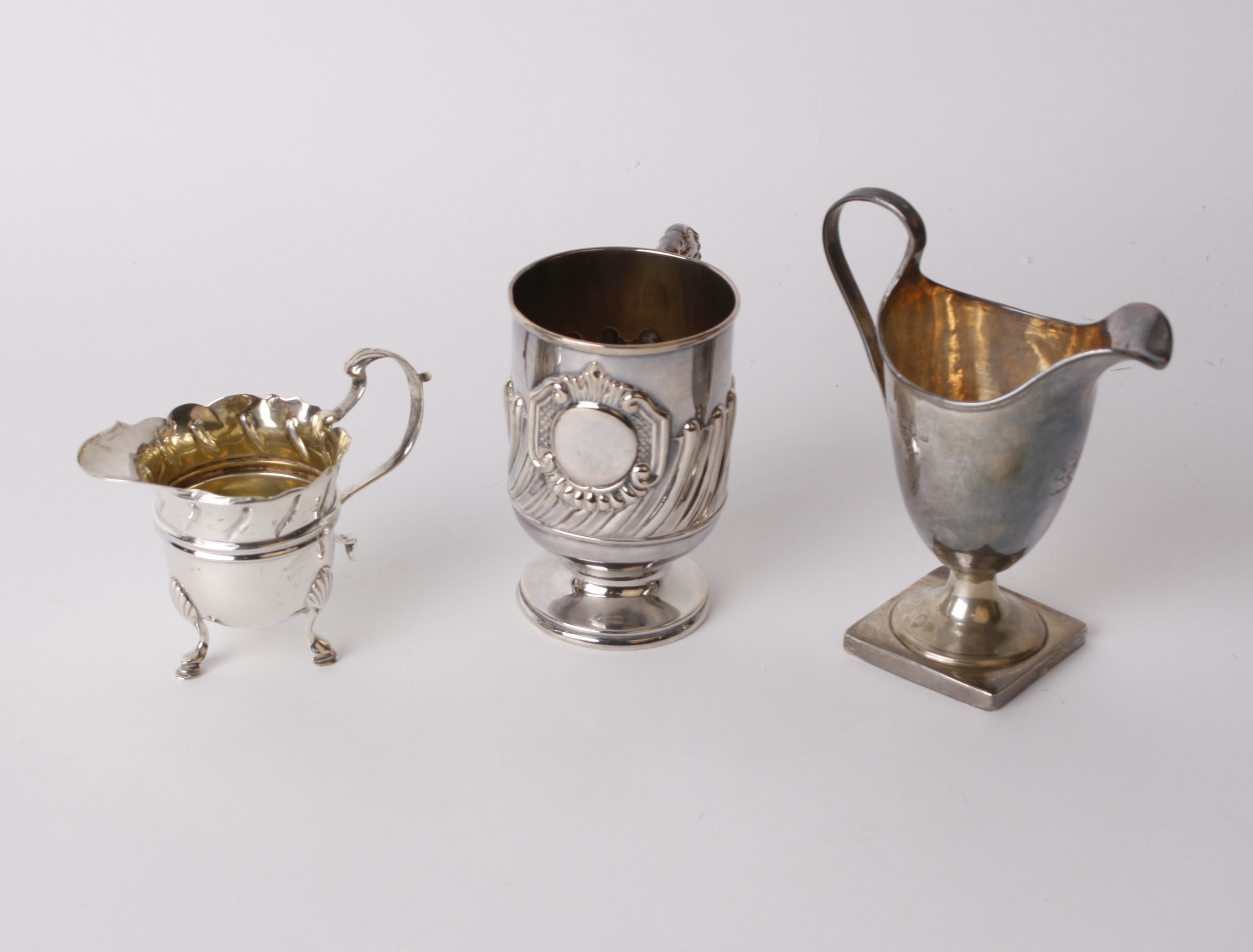 An Edwardian silver tankard, Levi & Salaman, Birmingham, 1903, 10cm high two silver jugs and a