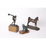 An Italian bronze figure of a discus thrower, a bronzed model of a dog and a resin model of a