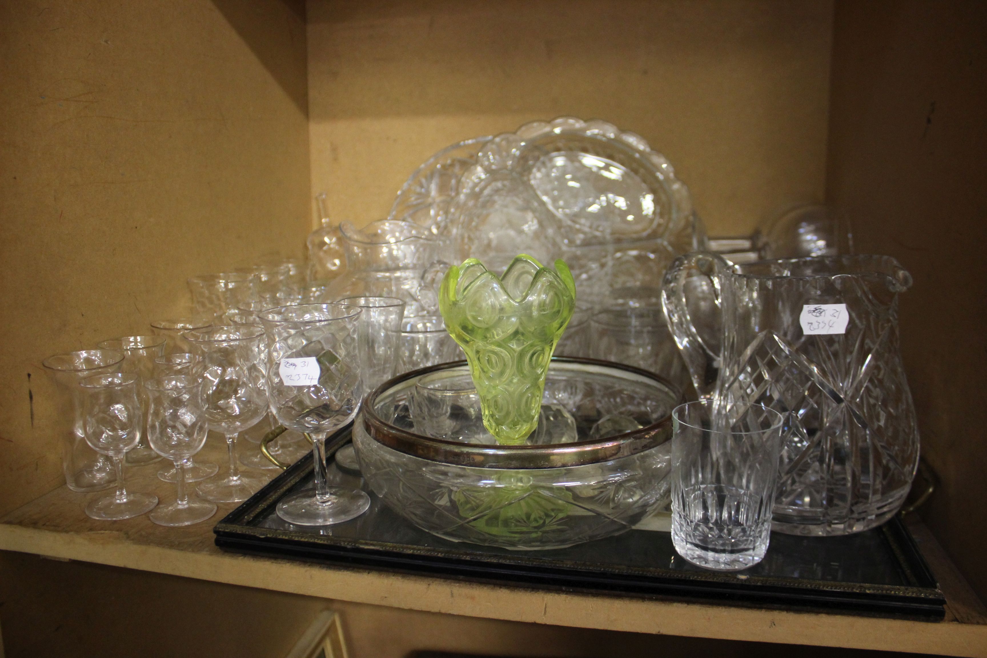 Glassware; table glass to include, champagne glasses, jugs, fruit bowls etc, two shelves