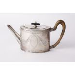 A 19th century Duth oval small teapot, the straight sides engraved with leaves and oval cartouche,