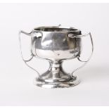 Silver; a three handled circular base pedestal bowl, Birmingham circa 1940's, a silver cased scent