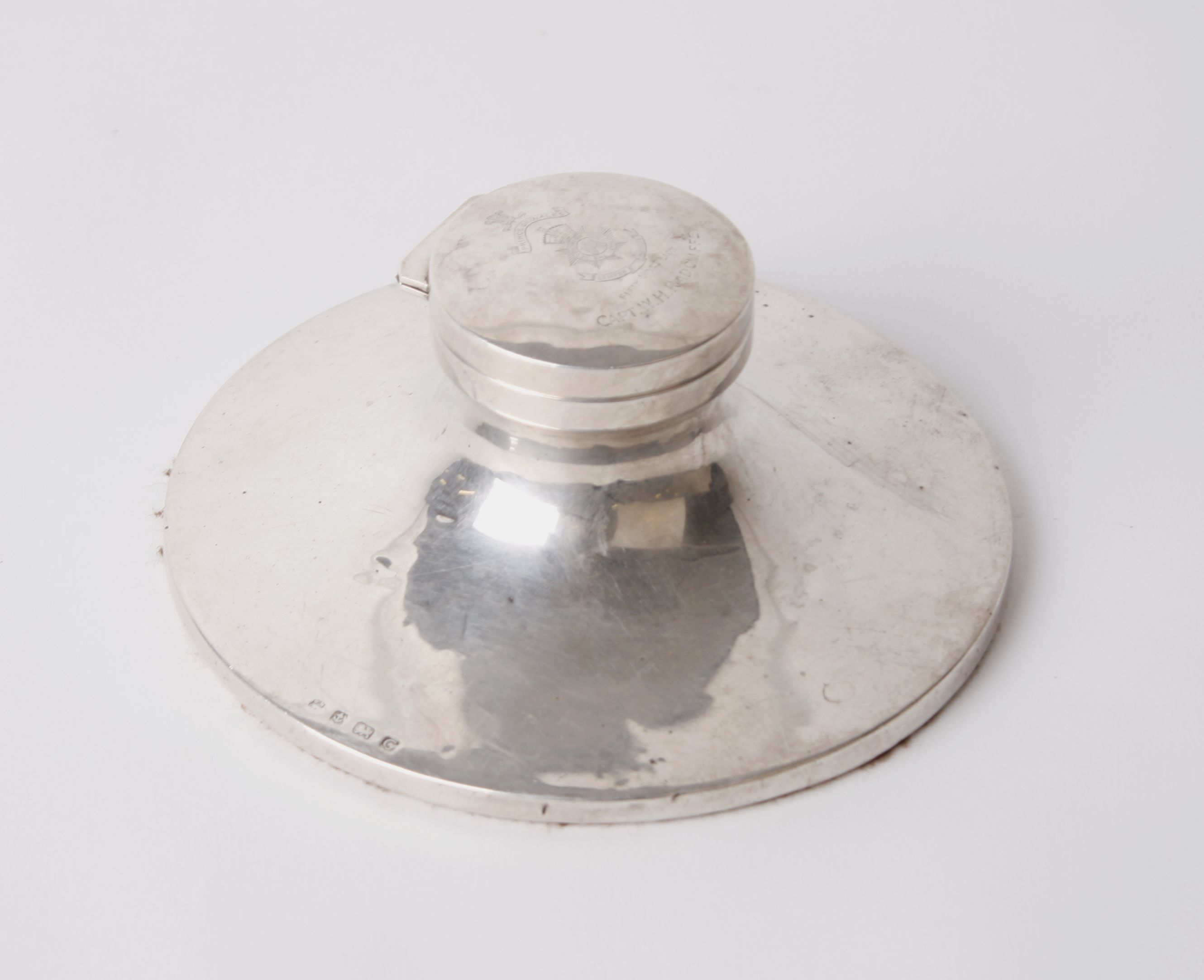 Silver; a capstan inkwell with wide base (6.5 cm) with liner. William Neale. Birmingham 1931,