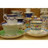 A collection of porcelain tea and coffee cups and saucers