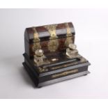 A Victorian rosewood and brass bound desk stand with two inkwells and page turner, width 34cm