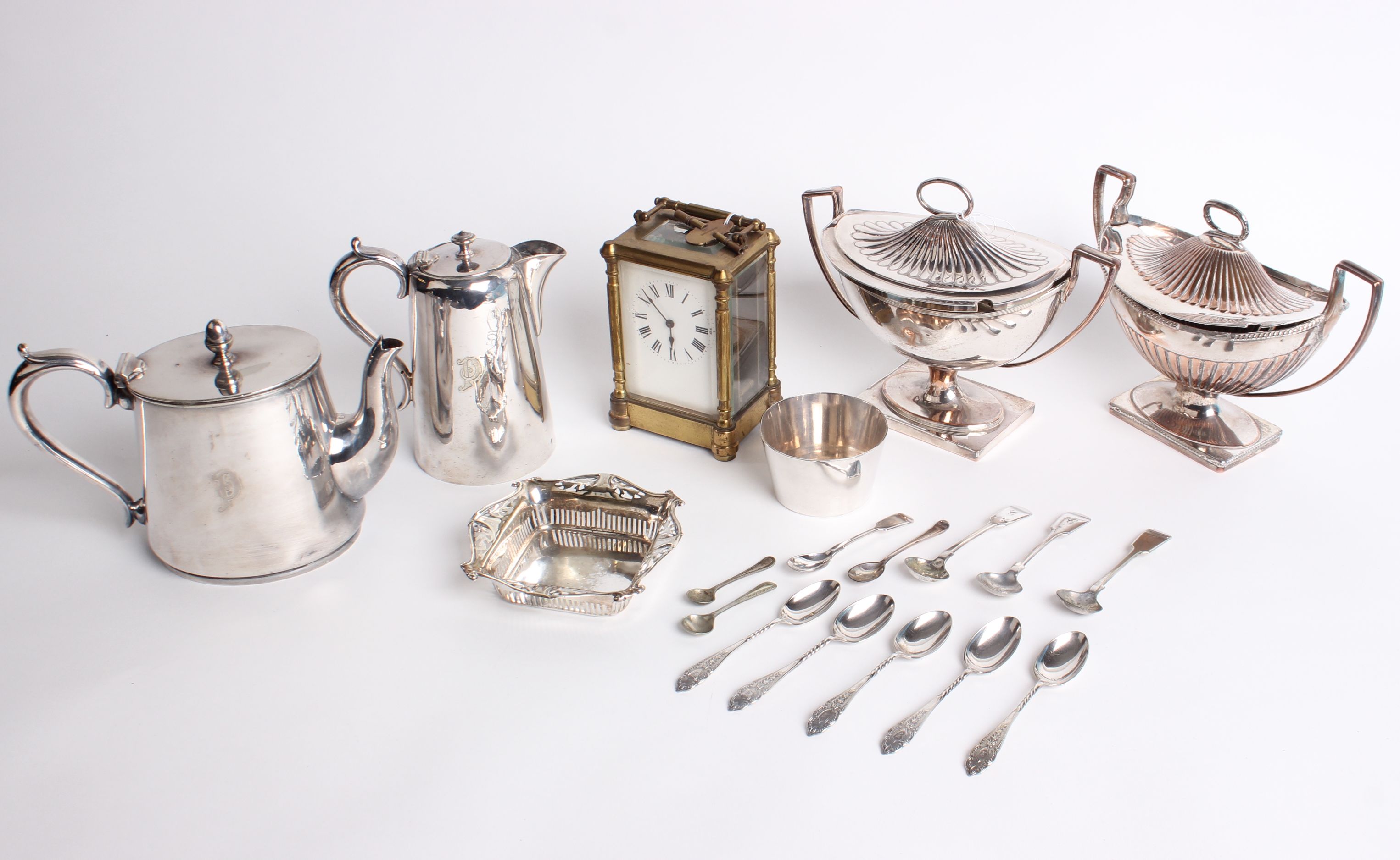 A collection of of plated items and a cased carriage clock; the plate includes two similar oval part