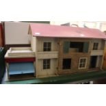 An early cream painted wooden model of a mobile home together with a dolls house, farm buildings,