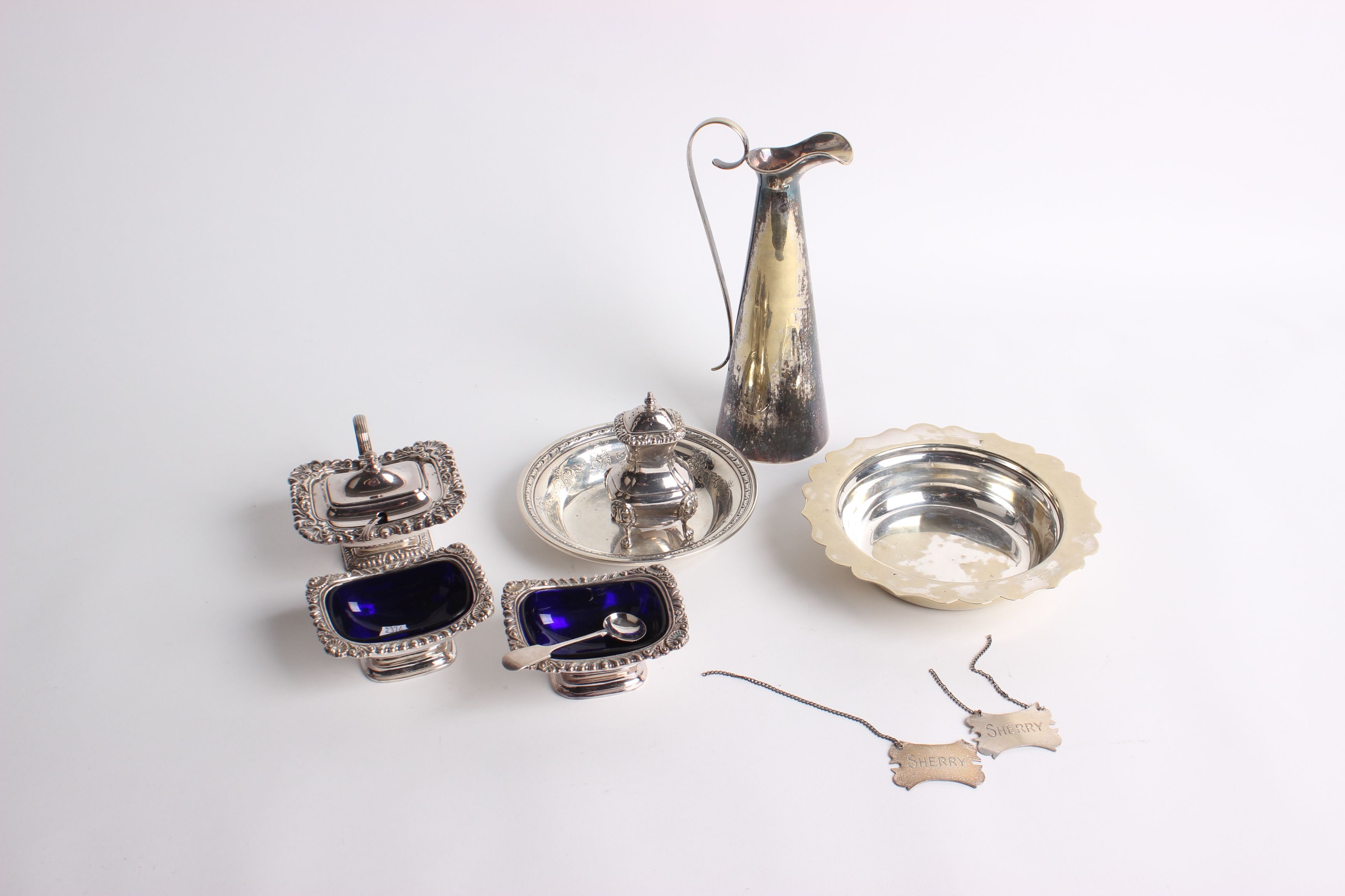 Silver Plate: A good Georgian style four piece cruet set with blue glass liners, box small cutlery