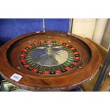 Two Roulette wheels with wooden bowls (pre 1960) and a box of casino chips