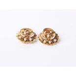 A pair of 18 ct gold, small sapphire and half cultured Pearl textured spiral crescent clip earrings,