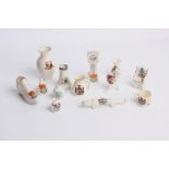 A collection of thirteen pieces of souvenir china including a Regency ware submarine and three photo