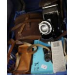 Photography: A Zeiss Ikon folding Compur camera with leather case, four other cameras and a pair