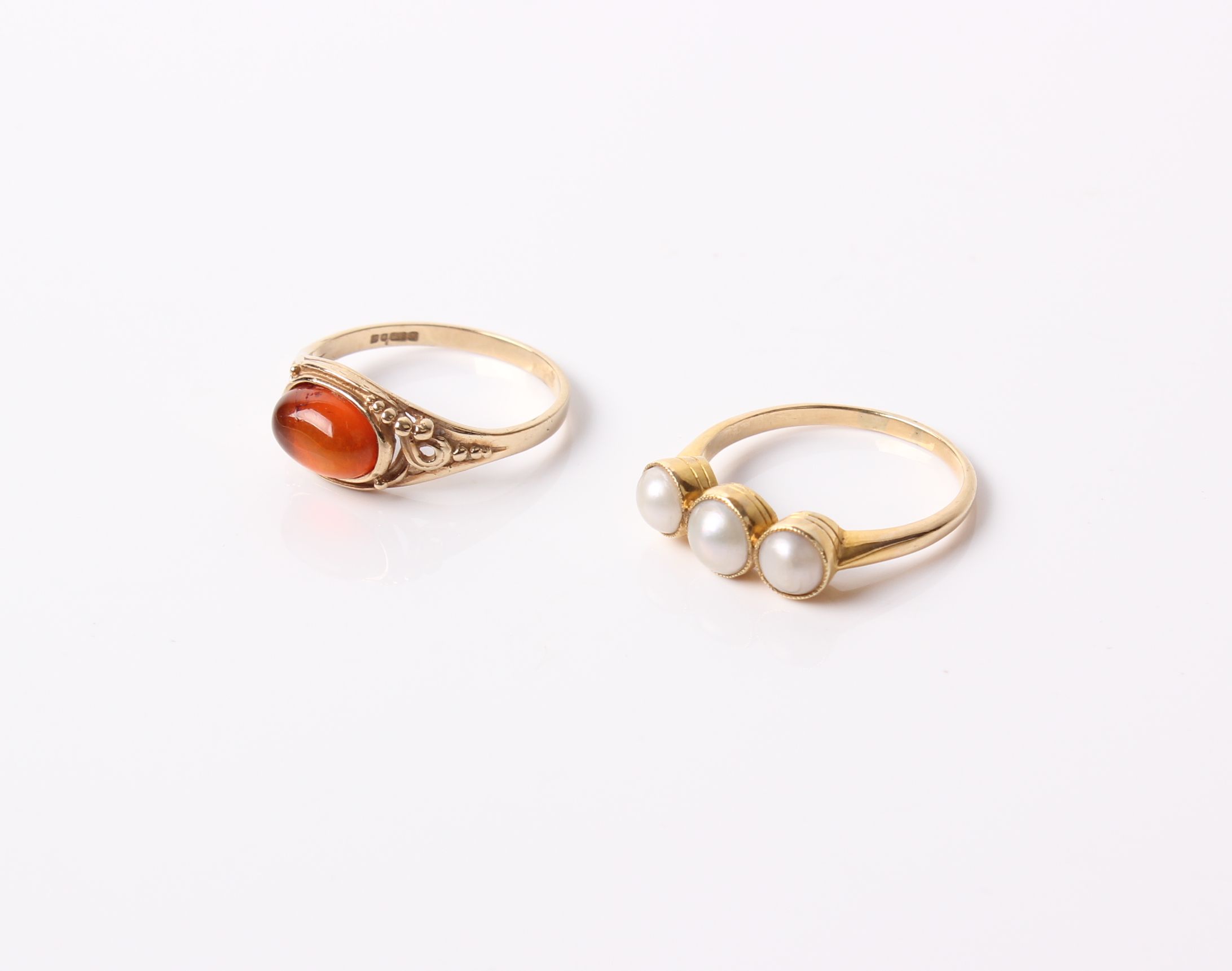 Two gold and Gem rings, comprising ; an early 20th century gold and graduated half-cultured pearl