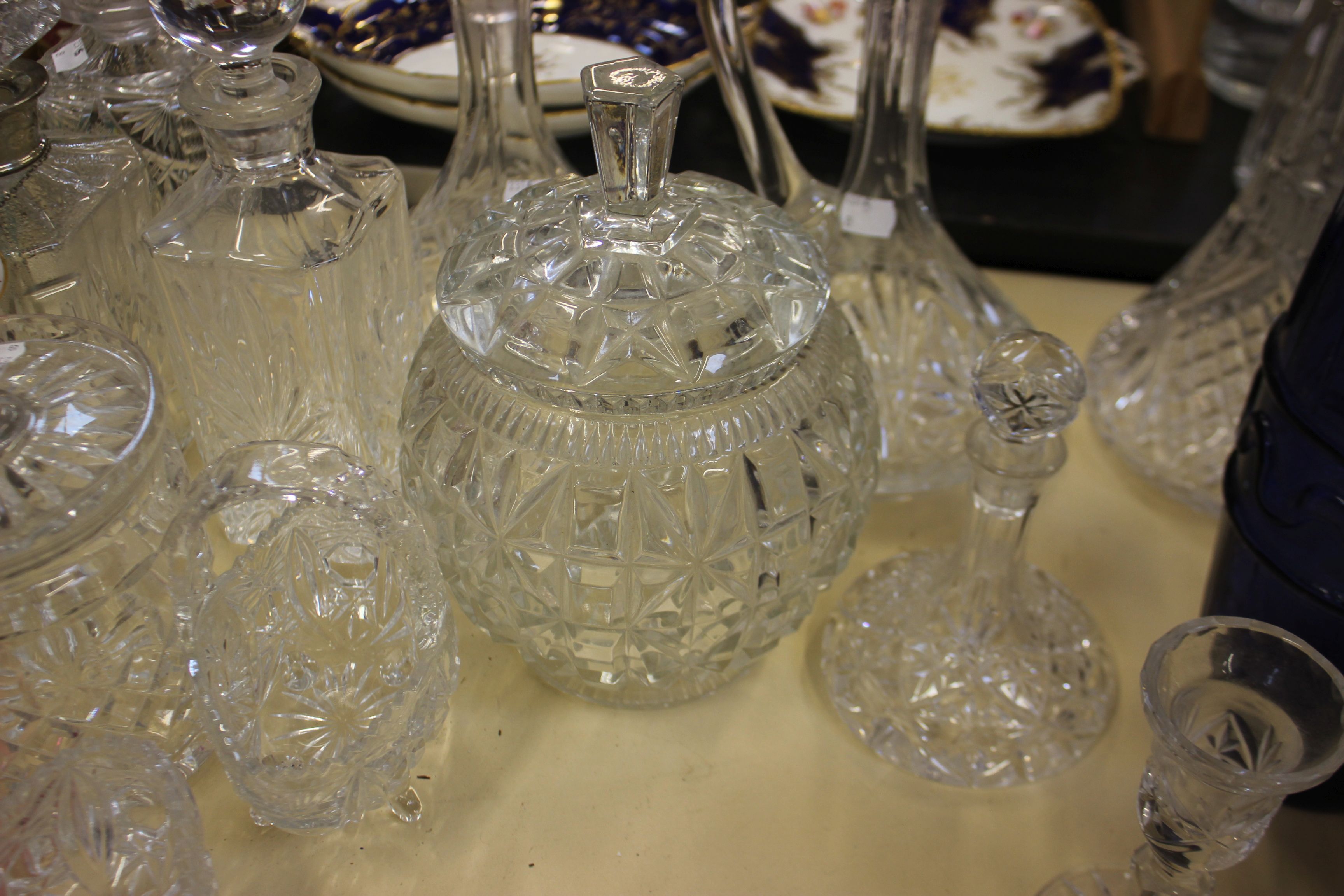 A Georgian style claret jug, together with a group of decanters and other glassware