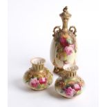 A Royal Worcester porcelain twin handled ovoid vase and cover, decorated with roses with a floral