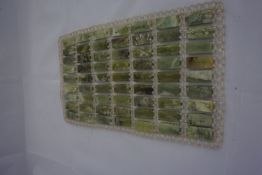 63 mounted pieces of nephrite