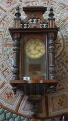 A Walnut stained wall clock with 8 day movement and a Victorian black slate and a Victorian marble
