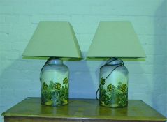A Pair of tin tea caddy lamps, painted with rural scenes