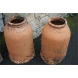 A pair of terracotta cloche
