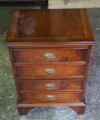 A reproduction mahogany four drawer dwarf chest of drawers.