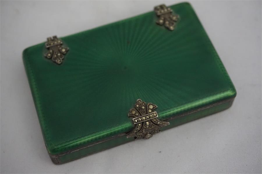 A continental silver gilt enamelled ladies pill box, decorated with marcasite hinges and clasp wit