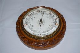 Late 19th century oak android barometer with rope twist decoration