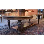 A mahogany oval victorian extending dining table with four leaves. Approx 11 ft by 4ft