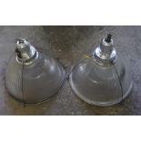 A pair of halo glass and silvered metal hanging station lamps from Livingston station, Glasgow. Diam