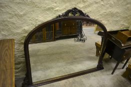Victorian style mahogany stained over mantle mirror.