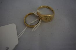 A 18ct gold gentleman's signet ring and 22ct wedding band