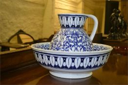 A blue and white pottery ewer and basin