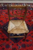 Late 19th century beech child's chair with rush seat and turned legs