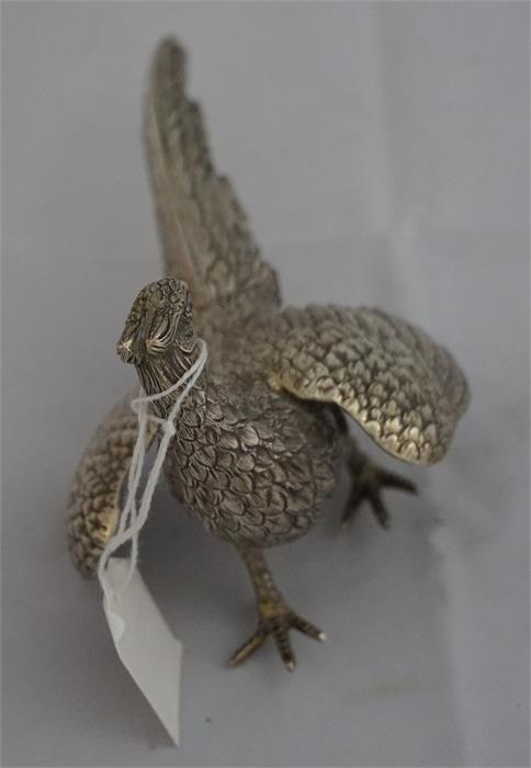 1 silver pheasant table decoration weighing 4.98 ounces