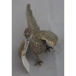 1 silver pheasant table decoration weighing 4.98 ounces