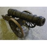 An ornamental (36 " overall length) cast iron cannon